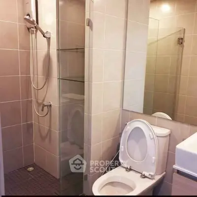 Modern bathroom with glass shower and sleek fixtures