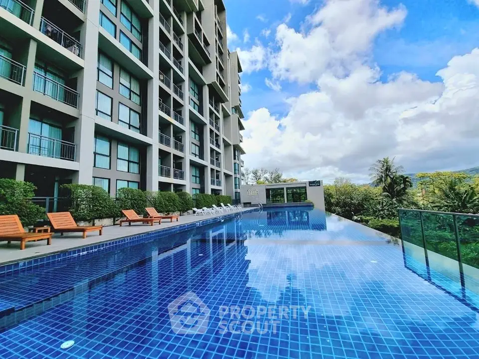 Luxurious condominium with stunning pool and lush surroundings, perfect for modern living.