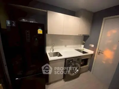 Modern compact kitchen with sleek appliances and efficient layout