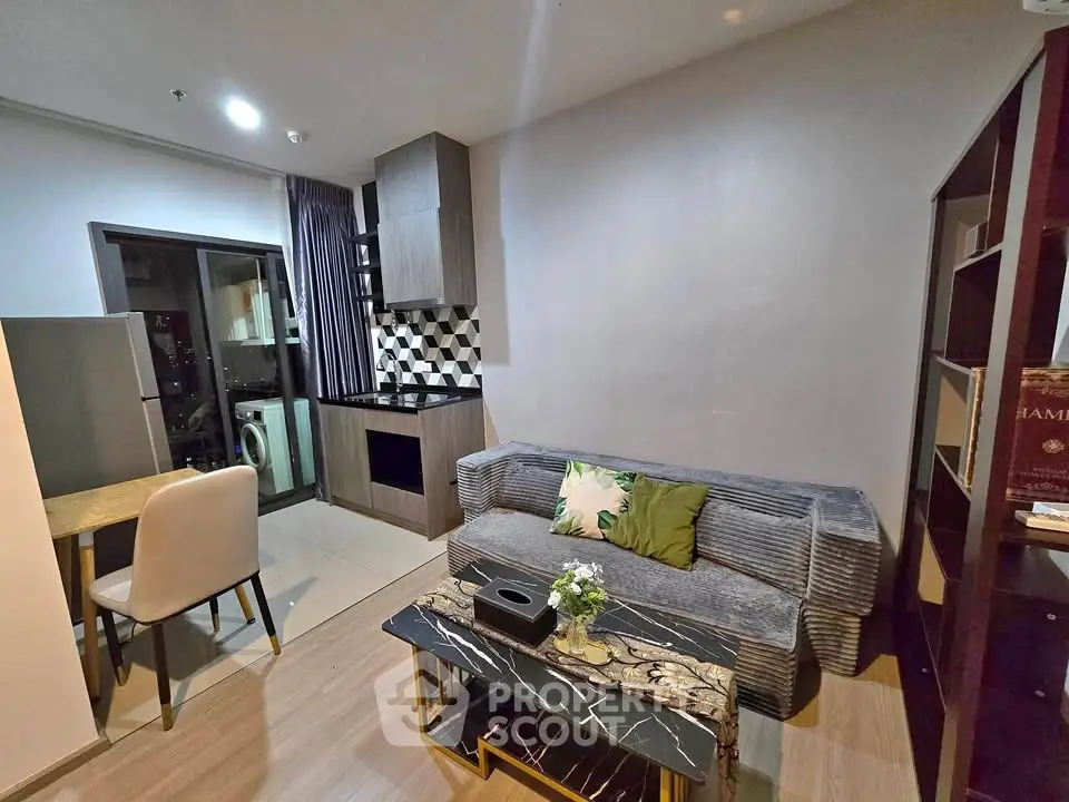 Modern living room with stylish decor and open kitchen layout