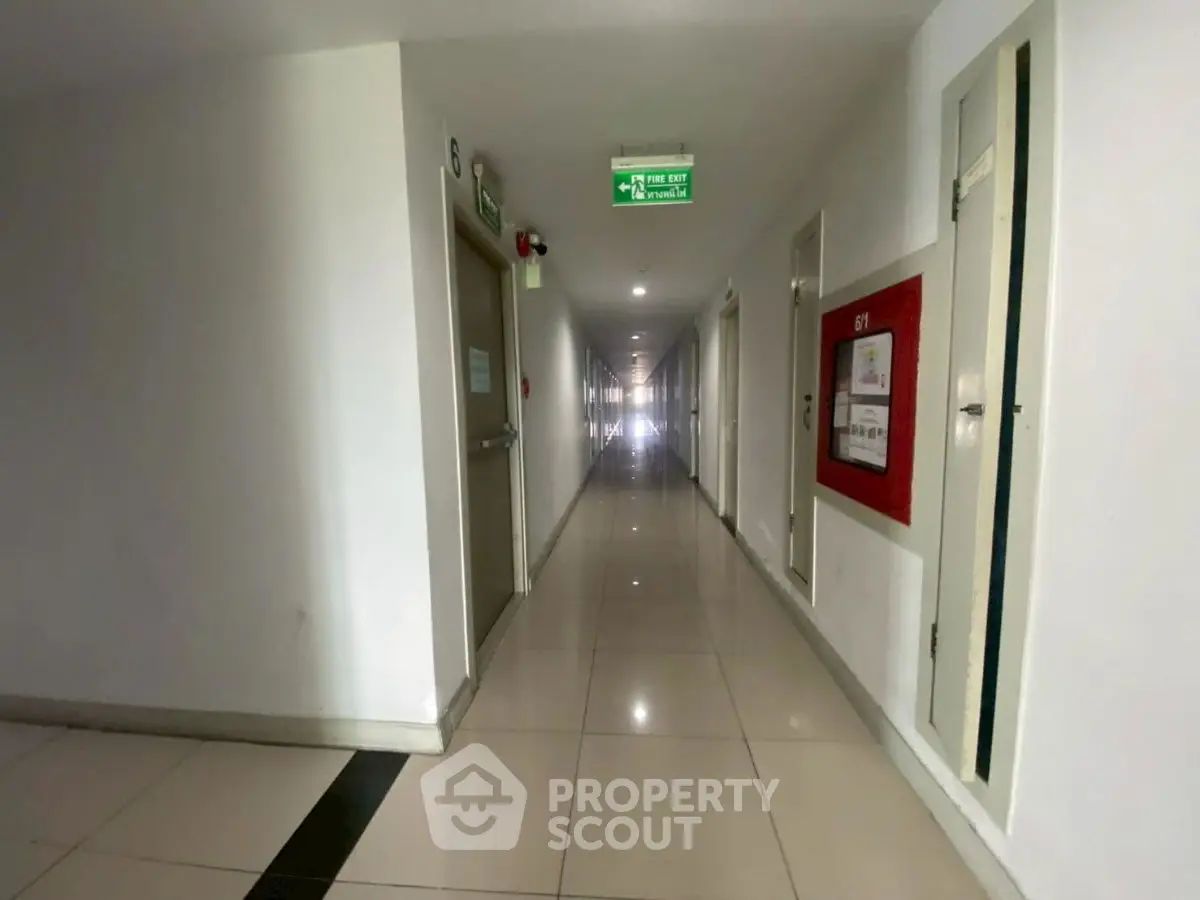 Spacious and well-lit apartment hallway with modern design