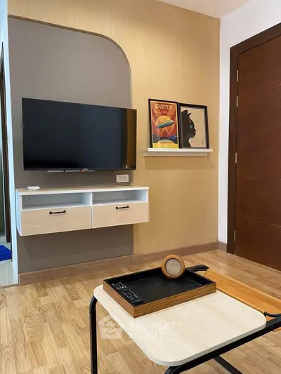Modern living room with wall-mounted TV and stylish decor