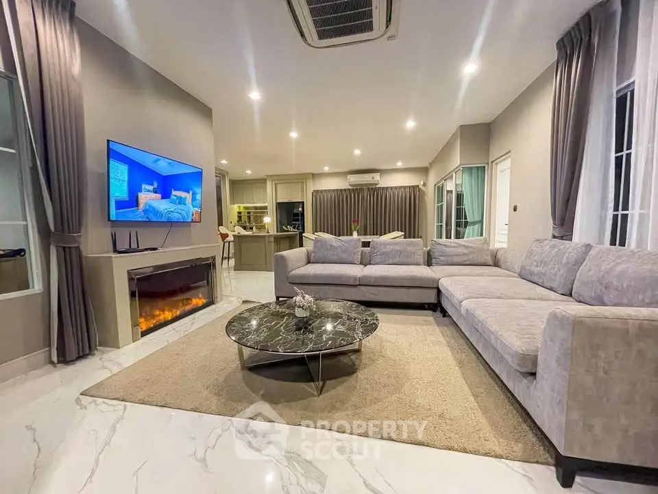 Luxurious modern living room with elegant furniture and ambient lighting, perfect for relaxation and entertainment.