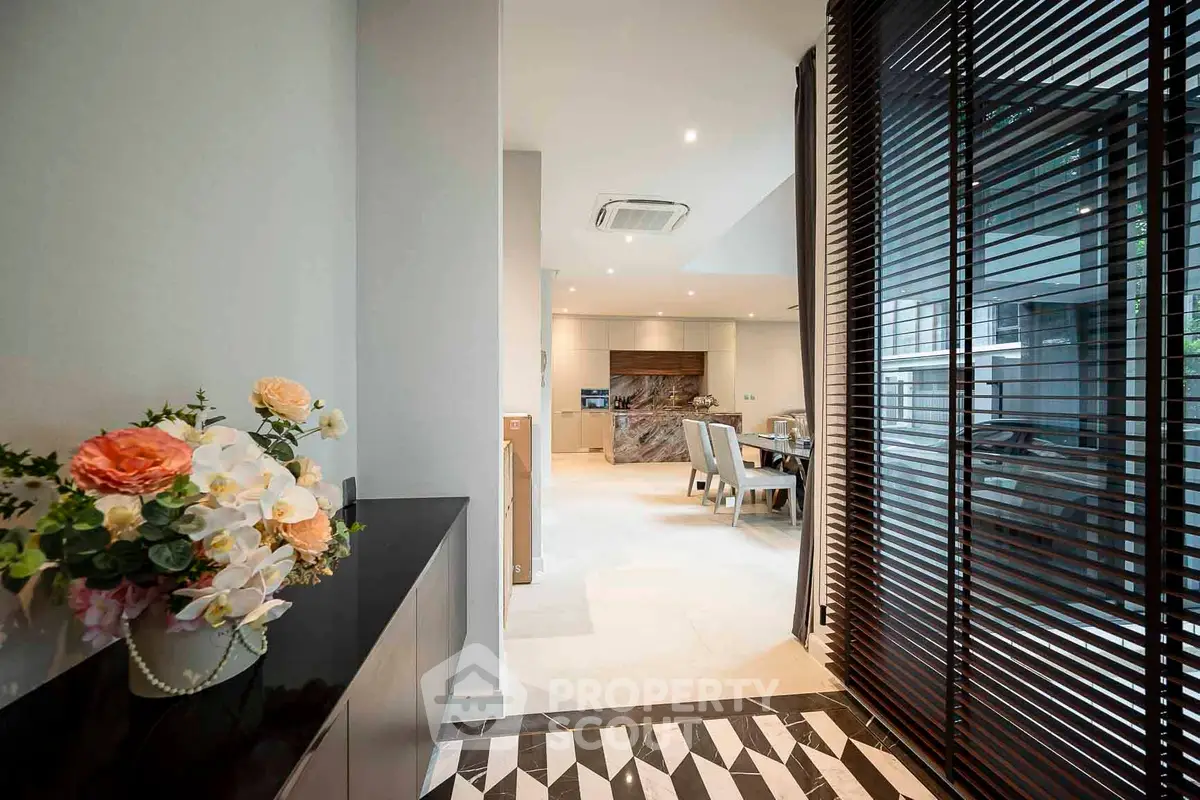 Luxurious open-plan living area with elegant dining space and modern decor