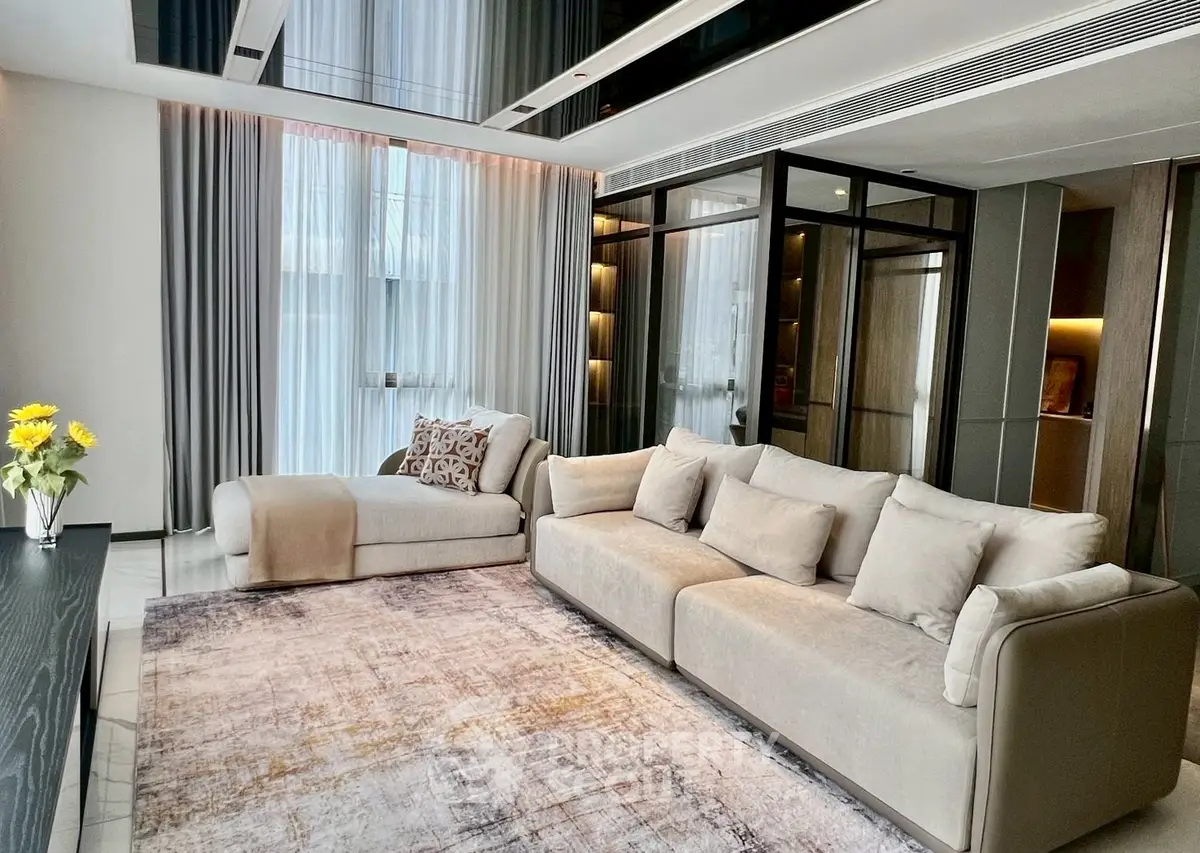 Luxurious modern living room with plush sofas and elegant decor
