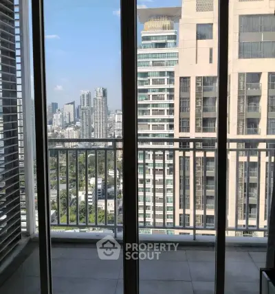 Stunning cityscape view from a high-rise balcony, perfect for urban living enthusiasts.