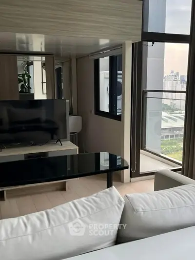 Modern living room with city view and sleek furniture
