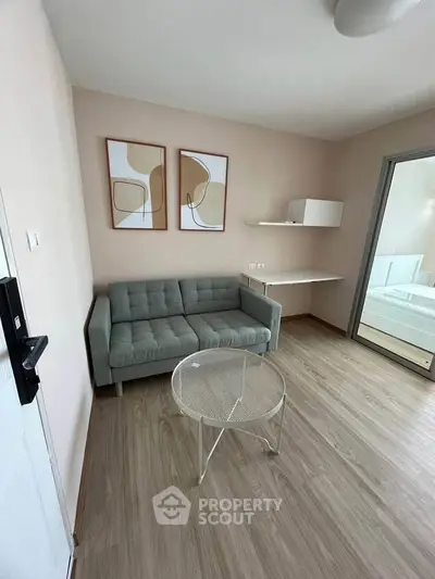 Modern living room with stylish decor and cozy sofa in a contemporary apartment.