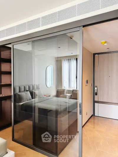 Modern living room with glass sliding doors and stylish furniture