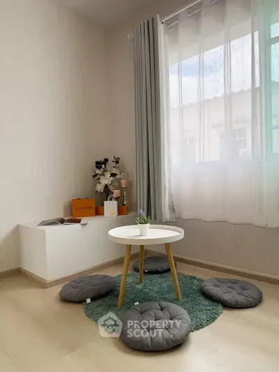 Cozy minimalist living room with natural light and modern decor
