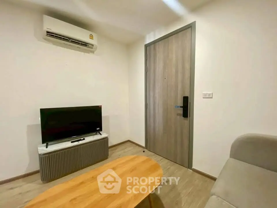 Modern living room with air conditioning and sleek wooden furniture, perfect for cozy urban living.