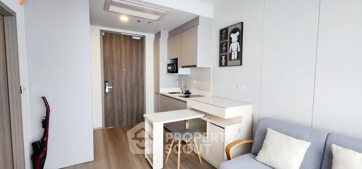 Modern compact living room with kitchenette and stylish decor