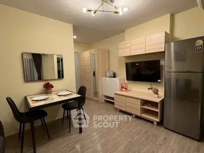 Modern dining and living area with sleek furniture and stylish decor