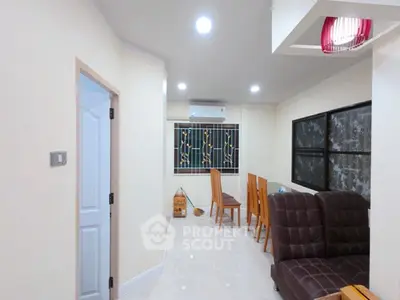 Spacious living room with modern furniture and bright lighting