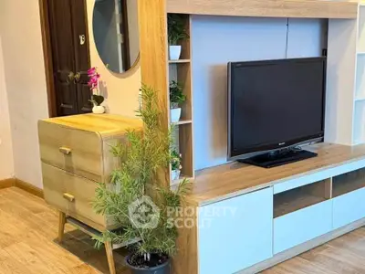 Modern living room with stylish wooden furniture and flat-screen TV