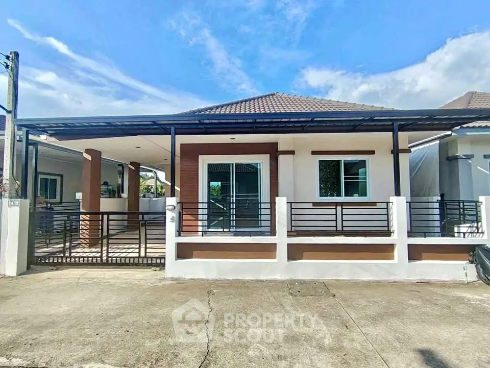 Charming single-story house with modern design and spacious driveway in a serene neighborhood.