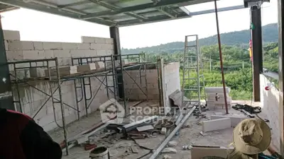 Under-construction building with scenic view and scaffolding