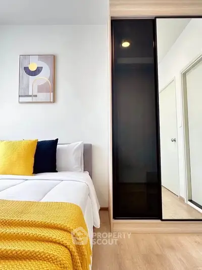 Modern bedroom with stylish decor and sliding wardrobe doors