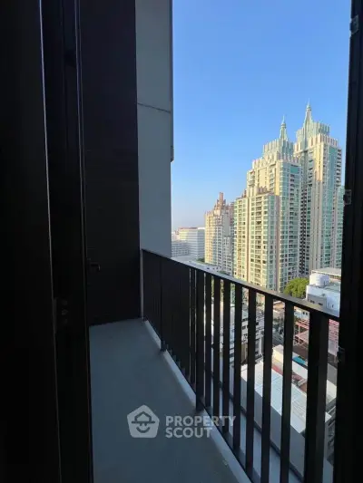 Stunning cityscape view from a modern apartment balcony with sleek railing design.