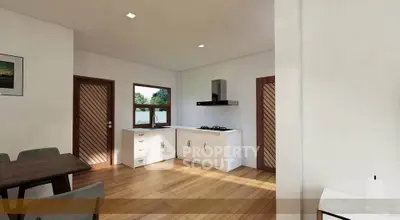 Modern kitchen with wooden flooring and open layout design