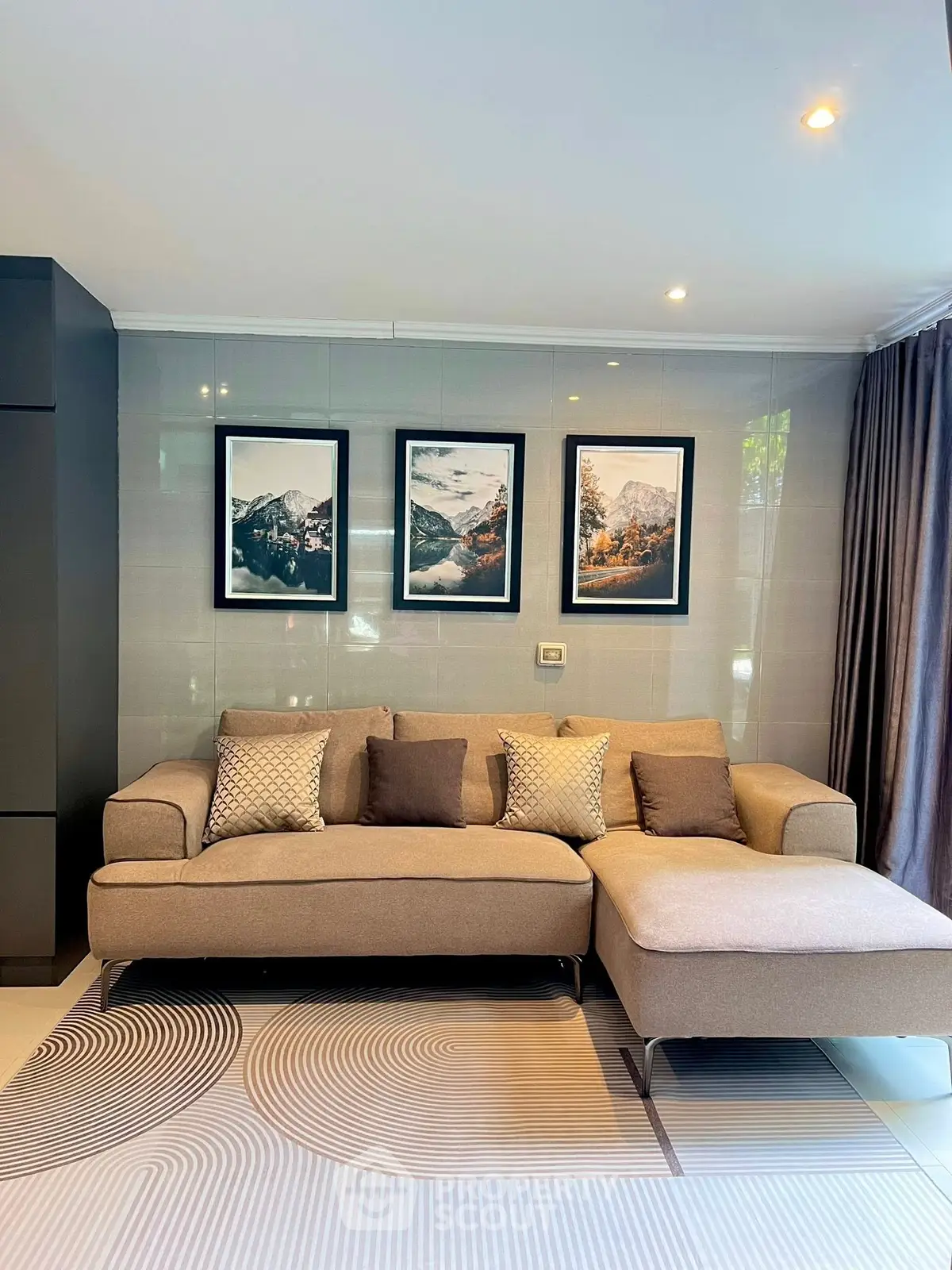 Stylish living room with modern sofa and elegant wall art, perfect for contemporary home decor.