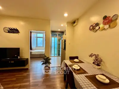 Charming open-layout living and dining area with modern decor and natural light.