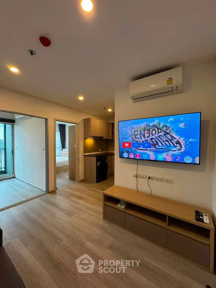 Modern living room with TV and air conditioning in a stylish apartment