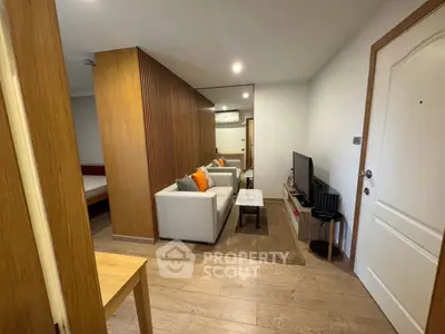 Modern living room with wooden accents and cozy seating area