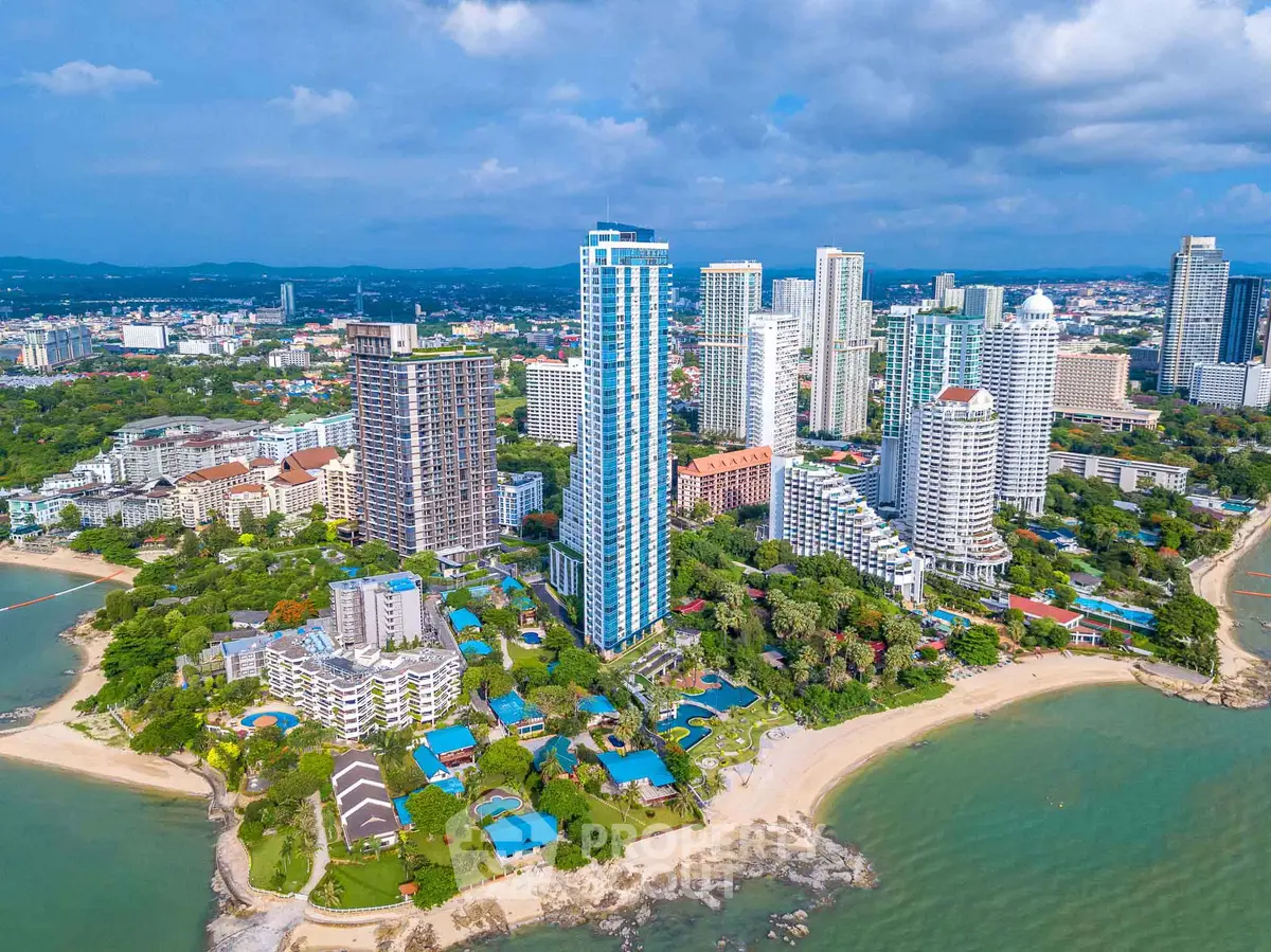 Stunning beachfront high-rise buildings with lush greenery and ocean views.