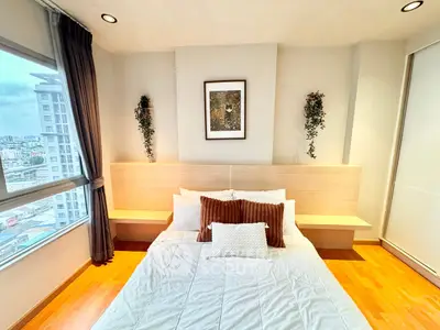 Modern bedroom with city view and stylish decor