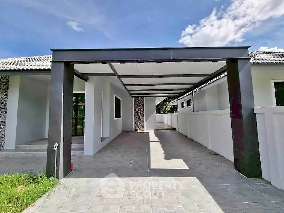 Modern single-story home with spacious carport and sleek design