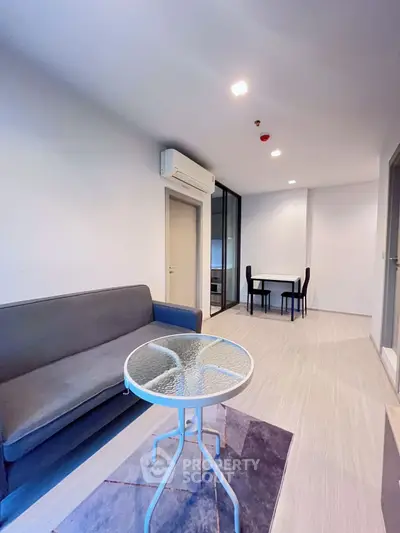 Modern living room with sleek furniture and air conditioning in a stylish apartment.