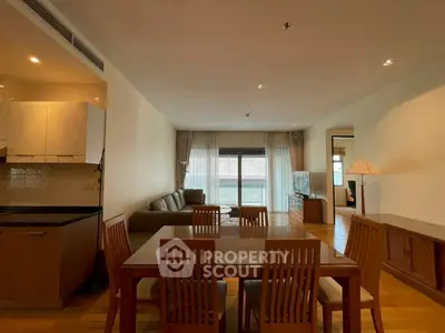 Spacious living room with dining area and modern furniture in open layout.