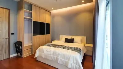 Modern bedroom with built-in wardrobe and cozy lighting
