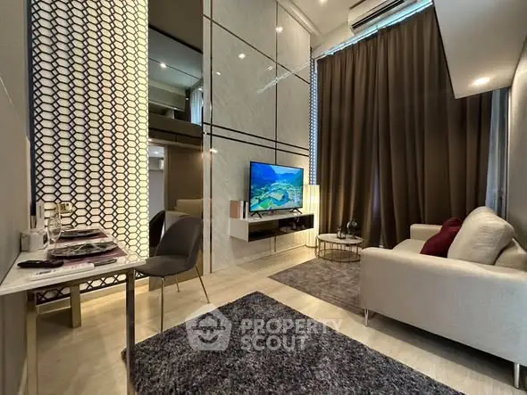 Modern living room with high ceiling and stylish decor in a luxury apartment.