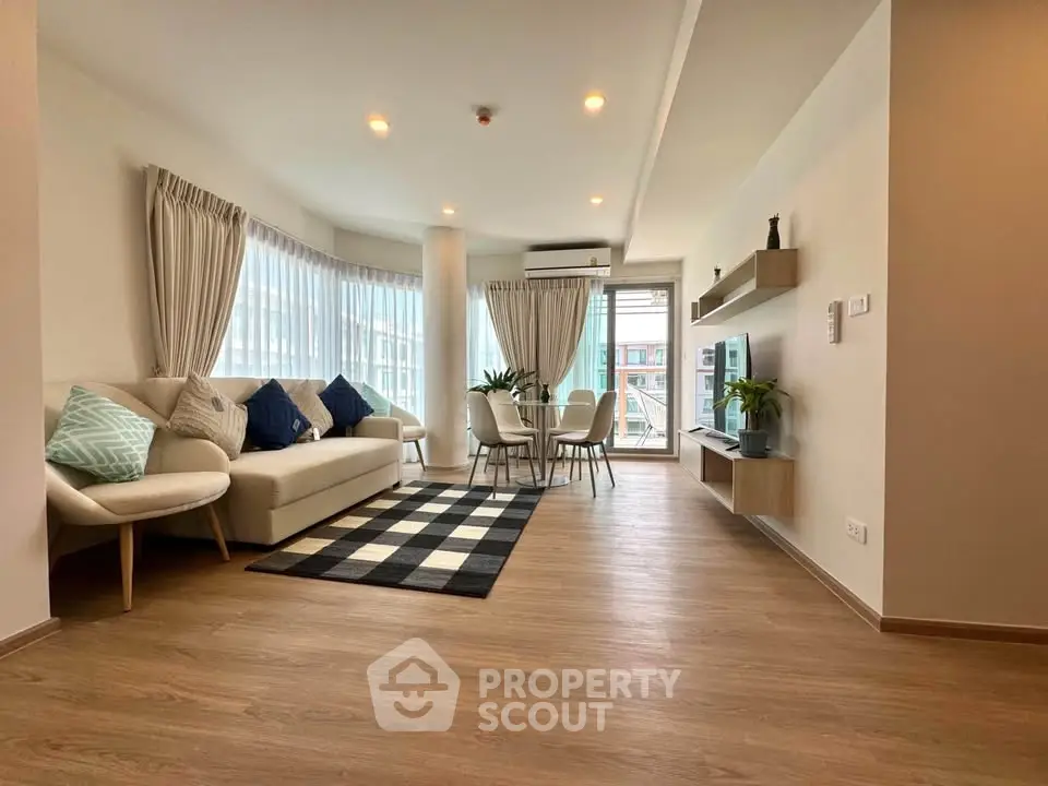 Spacious modern living room with elegant decor and natural light