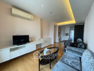 Modern living room with elegant furniture and open kitchen layout