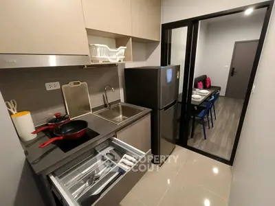 Modern compact kitchen with sleek appliances and open layout