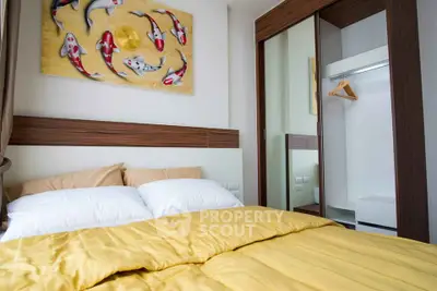 Cozy bedroom with modern decor and mirrored wardrobe