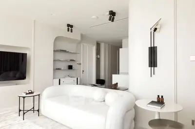 Modern minimalist living room with white sofa and sleek decor