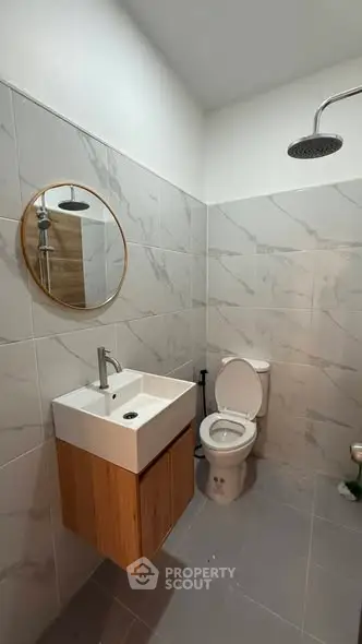 Modern bathroom with sleek fixtures and stylish tile design.
