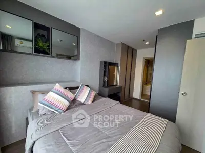 Modern bedroom with stylish decor and cozy ambiance in a contemporary apartment.