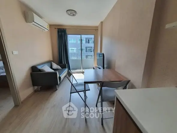 Modern living room with balcony view in a cozy apartment