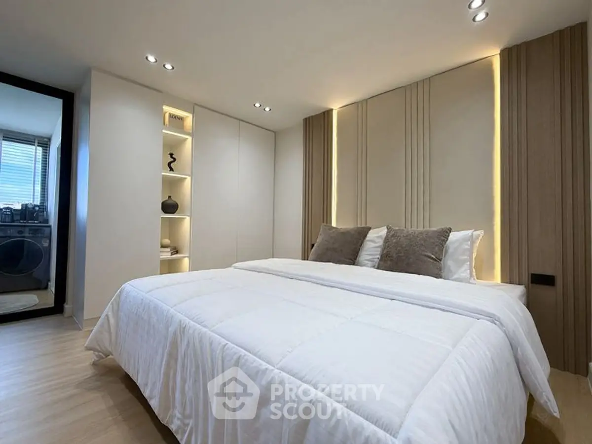 Luxurious modern bedroom with elegant lighting and cozy decor