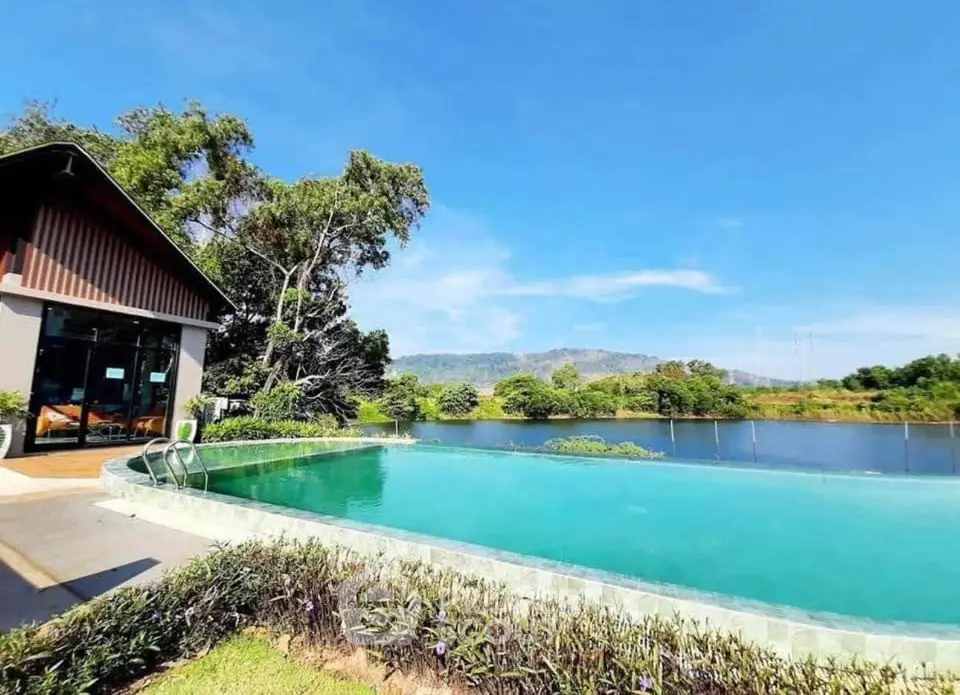 Stunning lakeside property with infinity pool and scenic mountain views