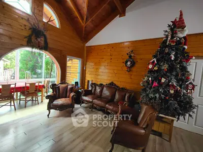 Charming rustic living room with high ceilings and festive decor