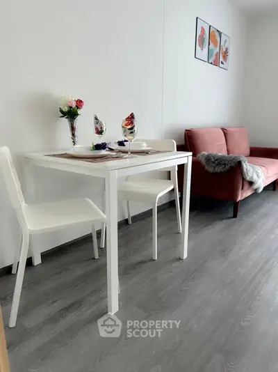 Chic modern living room with stylish dining area and cozy sofa, perfect for urban living.