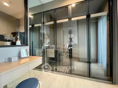Modern bedroom with glass wardrobe and stylish decor