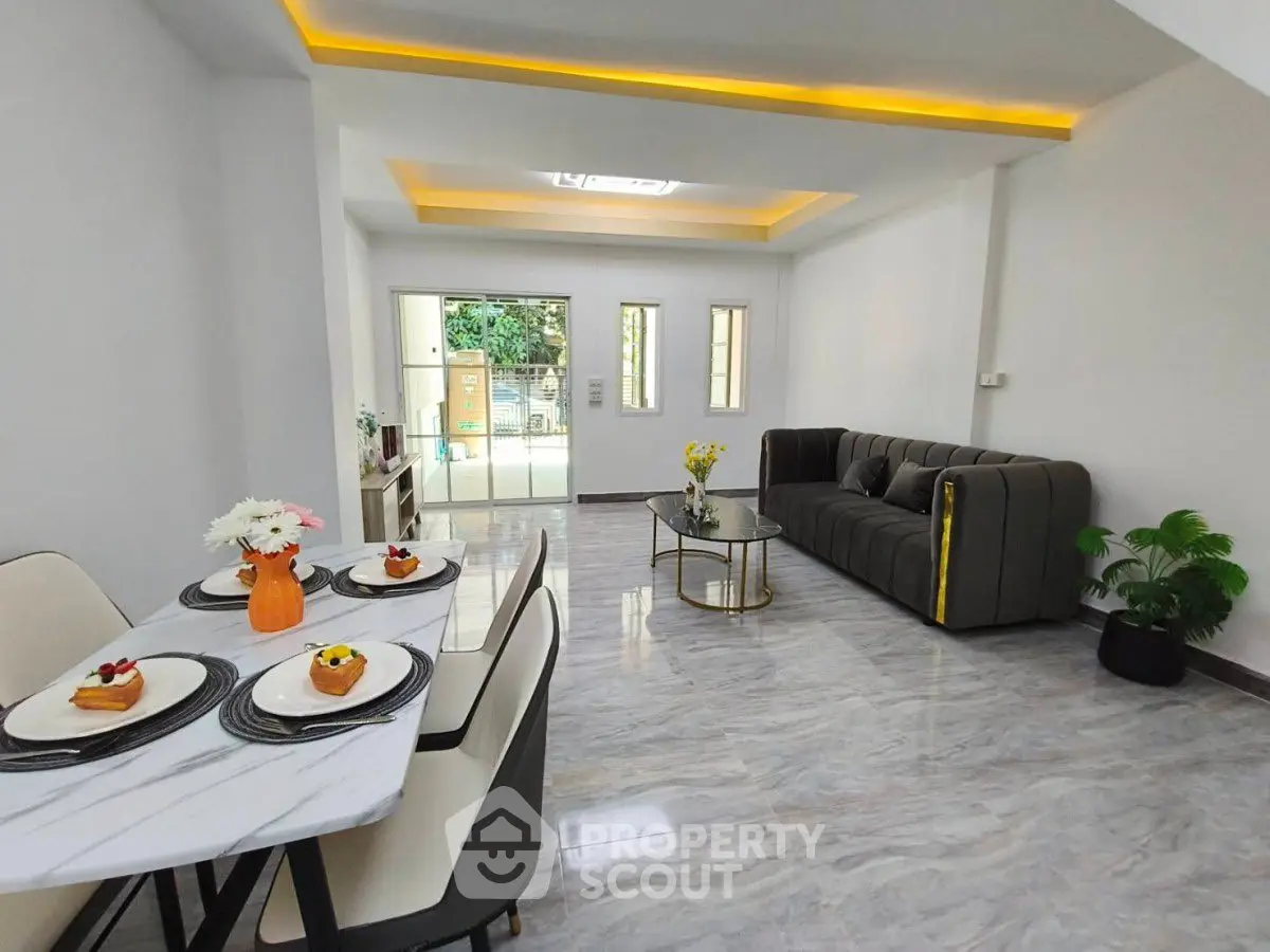 Spacious modern living room with elegant dining area and stylish decor