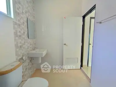 Modern bathroom with sleek design and neutral tones
